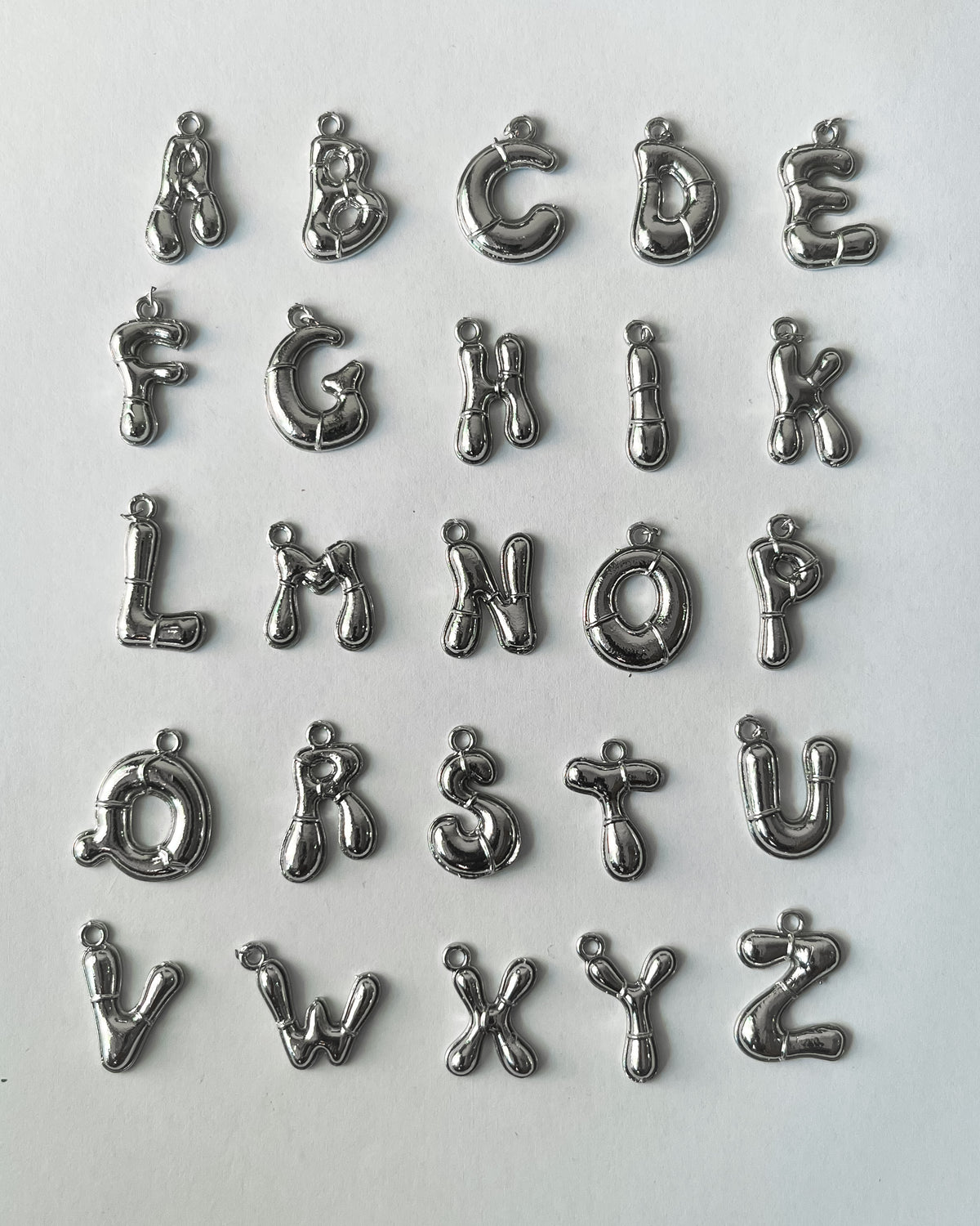 Alphabet mix charms- 100 grams
