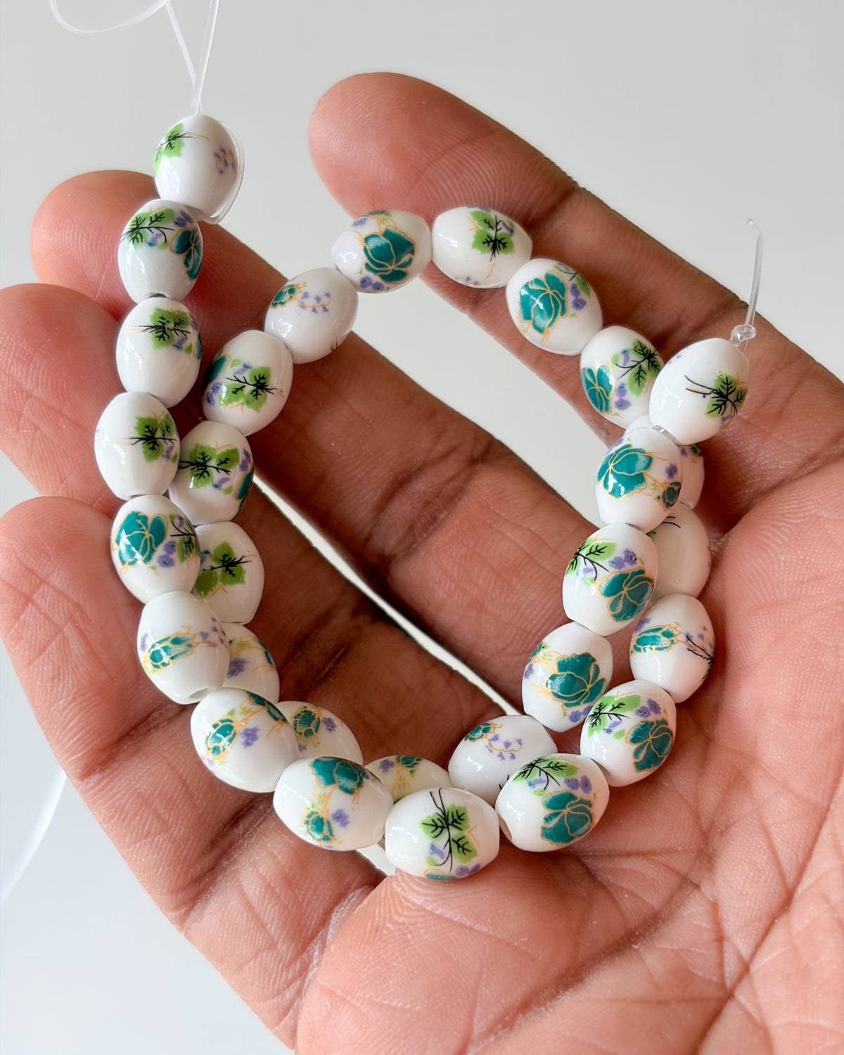 4.0 oval ceramic flower beads - 1 line