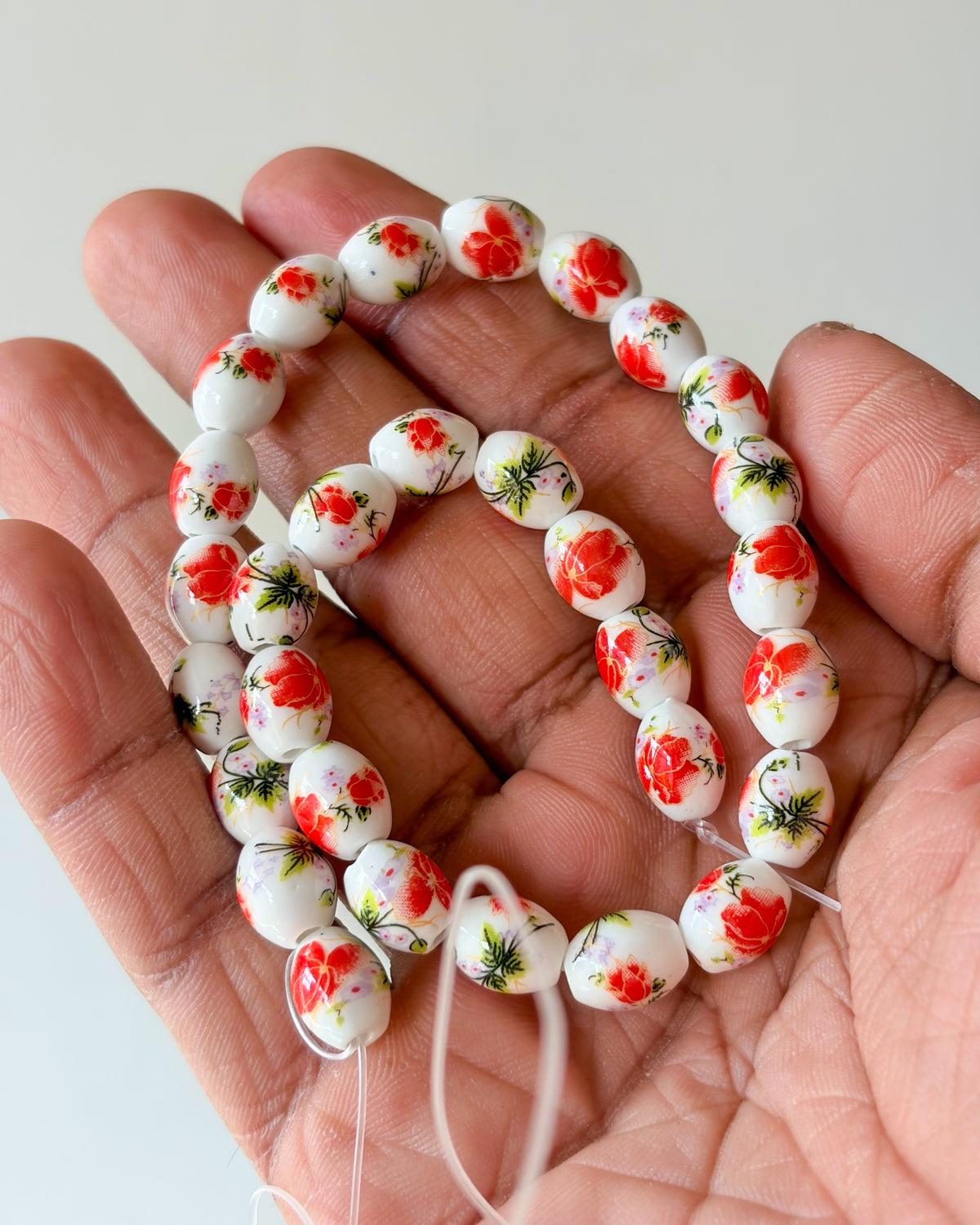1.0 oval ceramic flower beads - 1 line