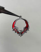 Red bat wing charm