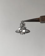White saturn heart charm