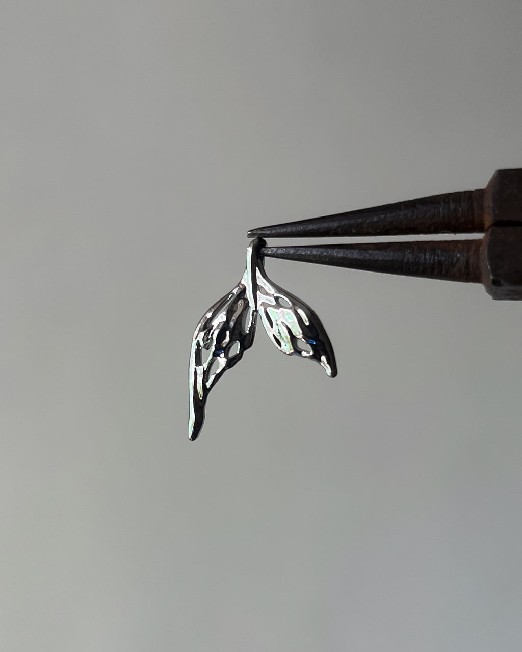 Fish tail charm