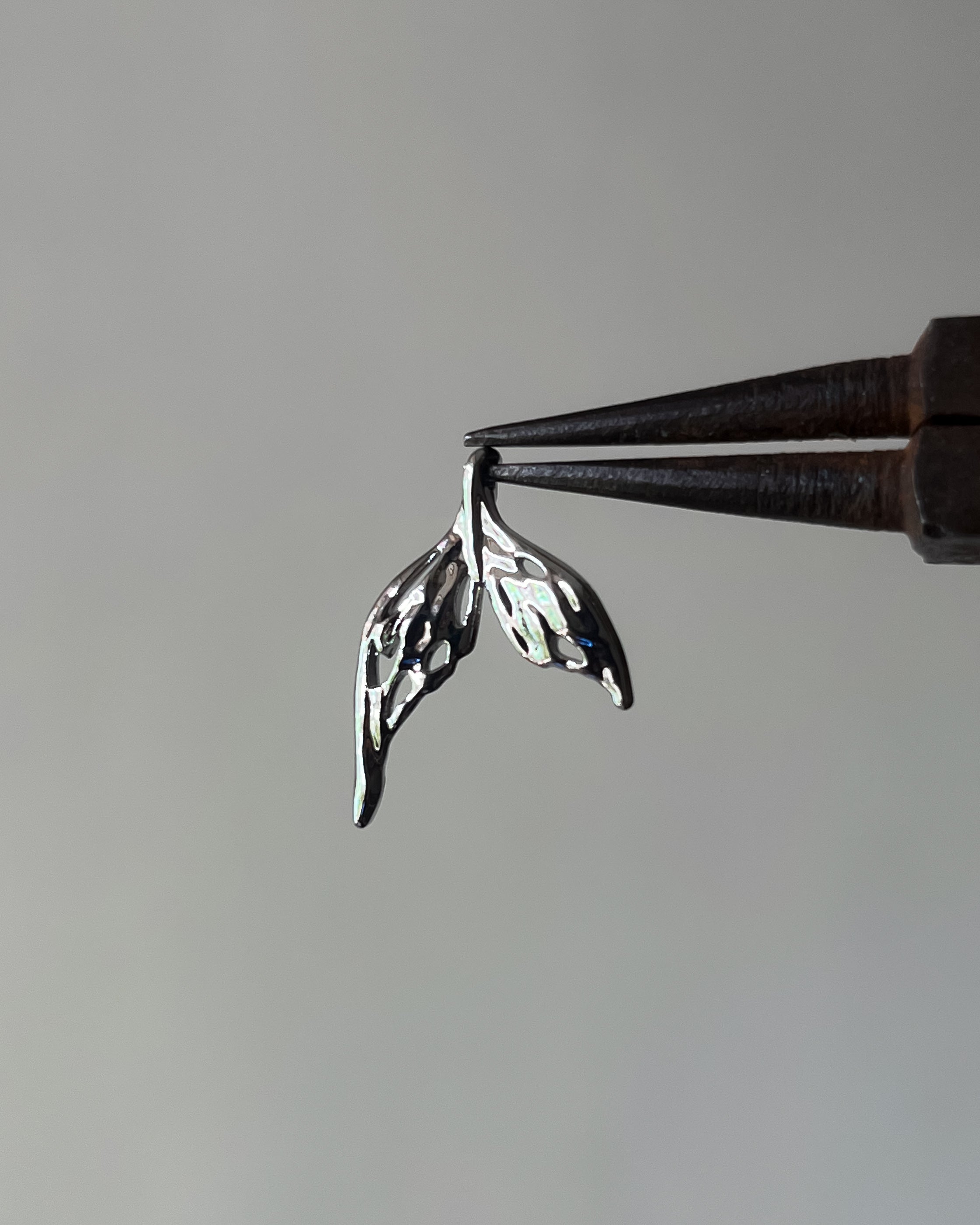 Fish tail charm