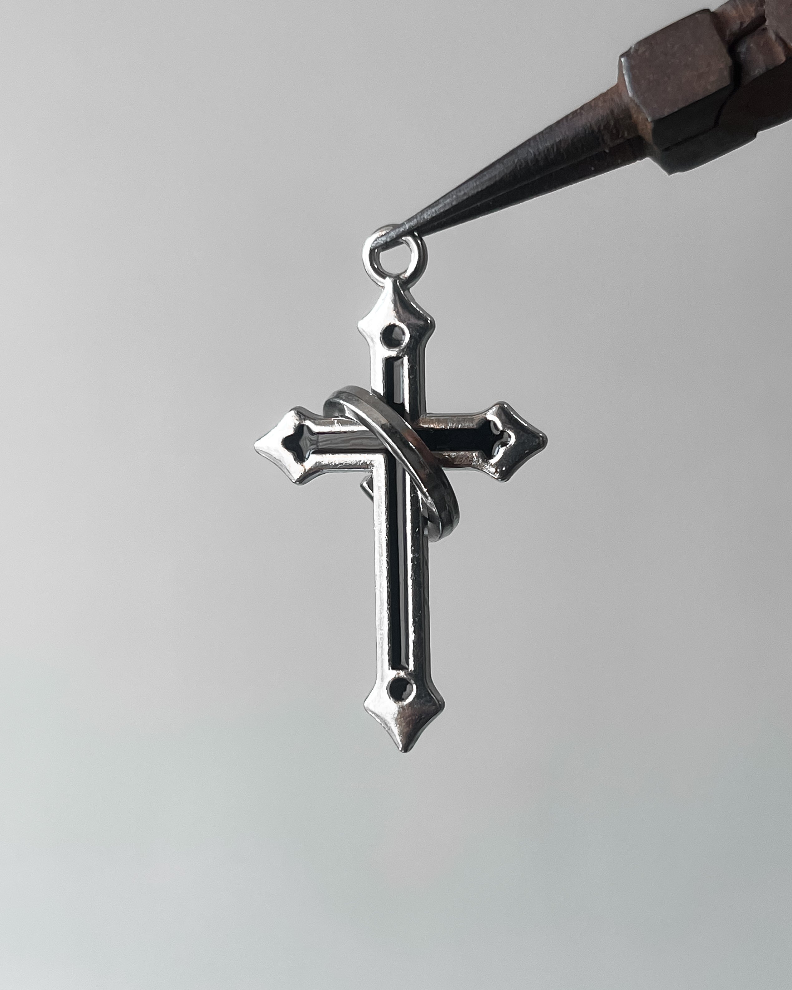Black ring cross pendant