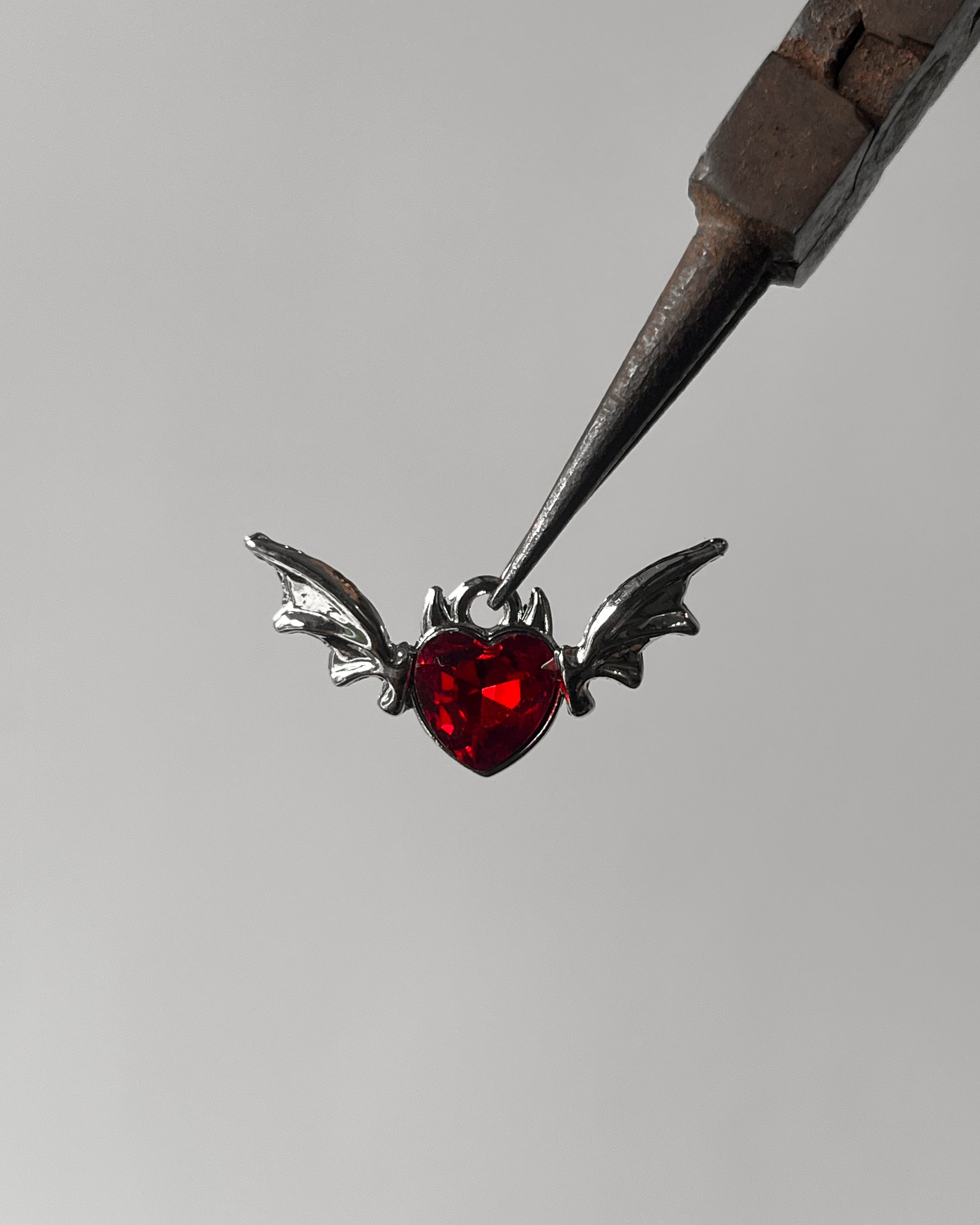 Red heart wing charm