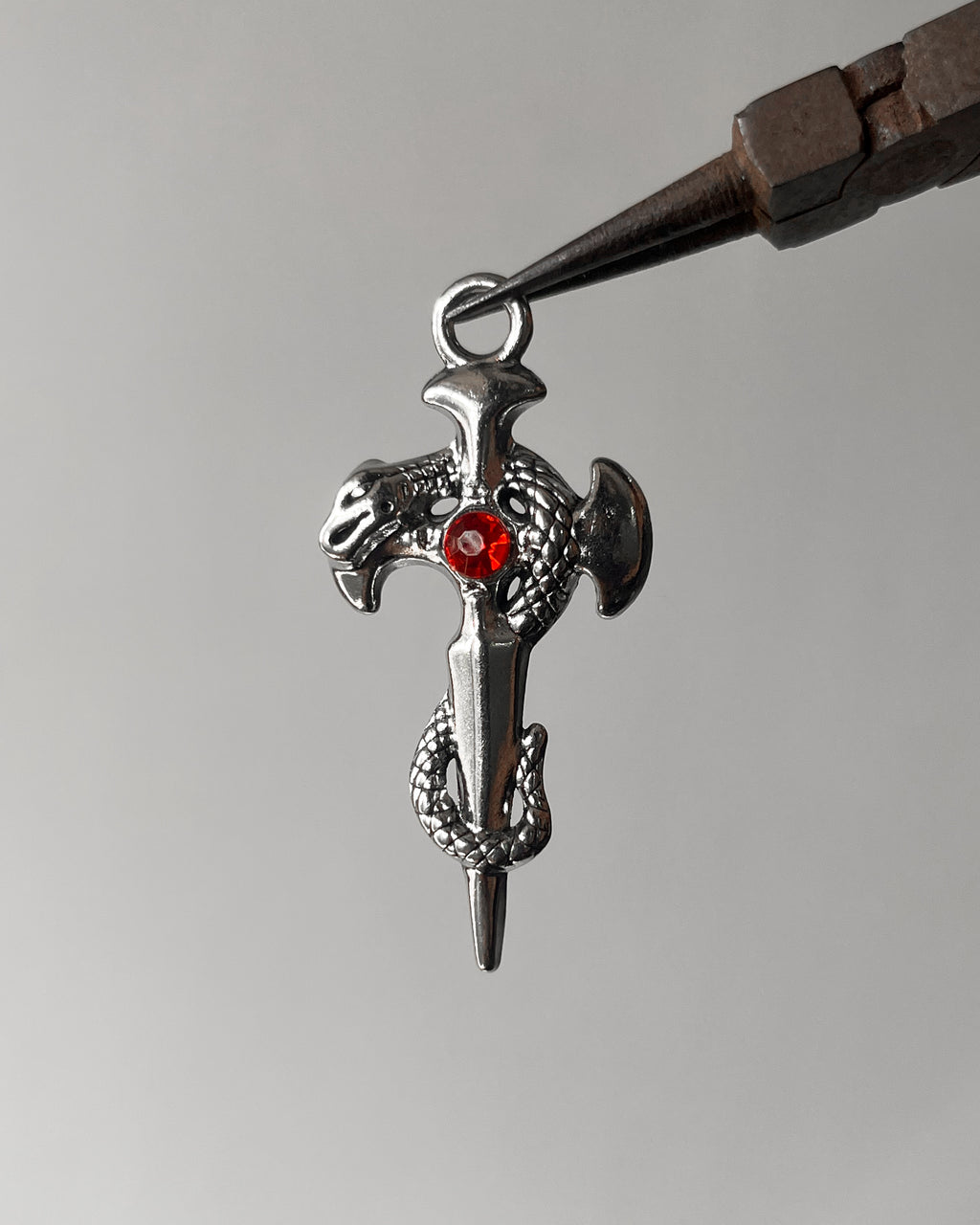 Red snake cross pendant