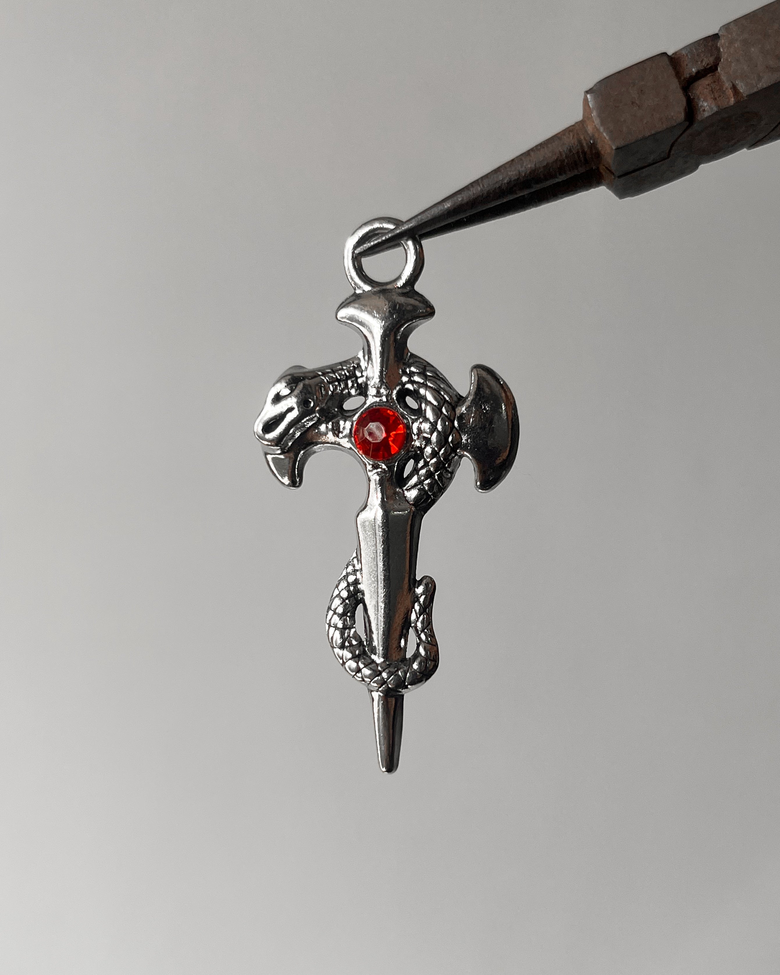 Red snake cross pendant