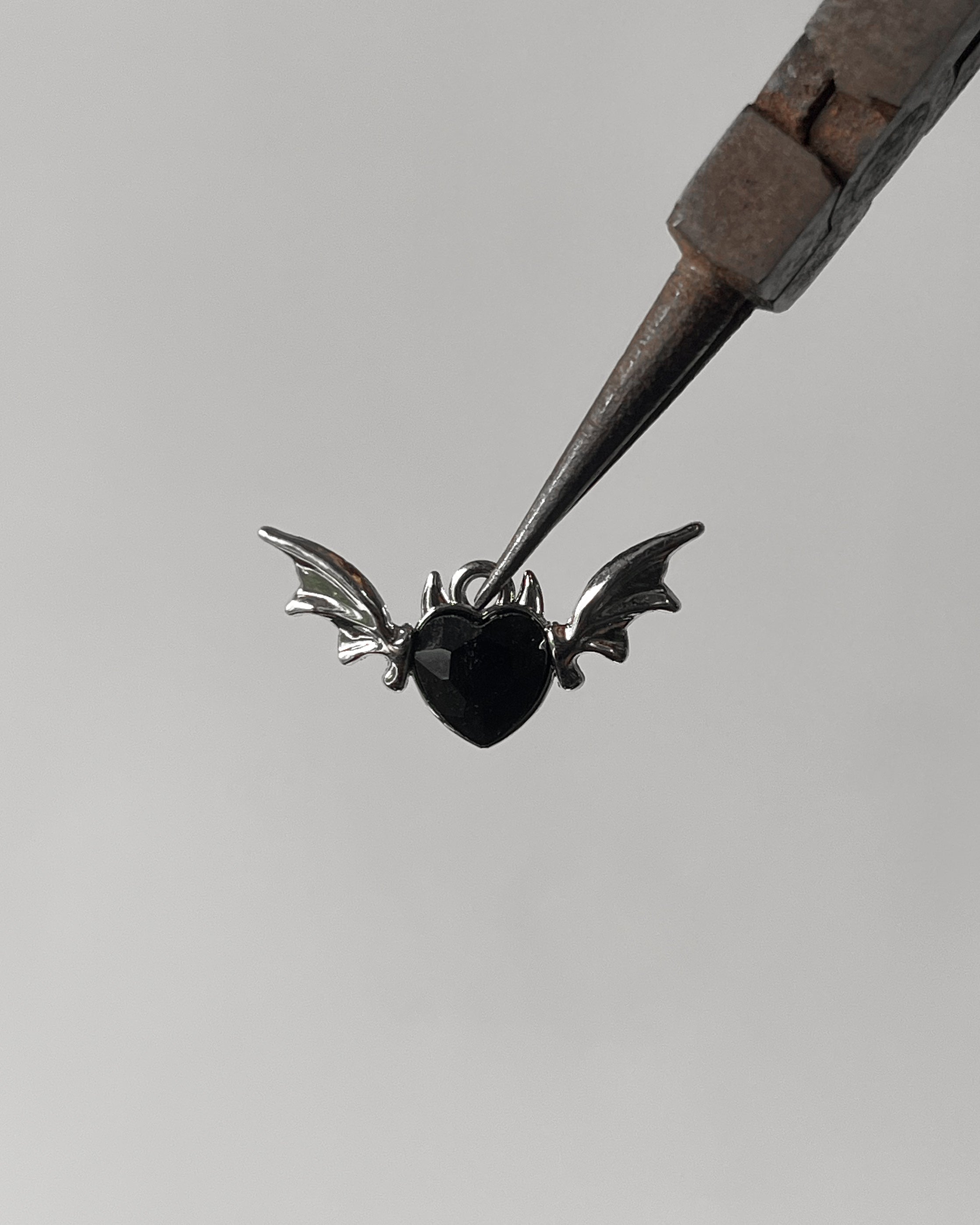 Black heart wing charm