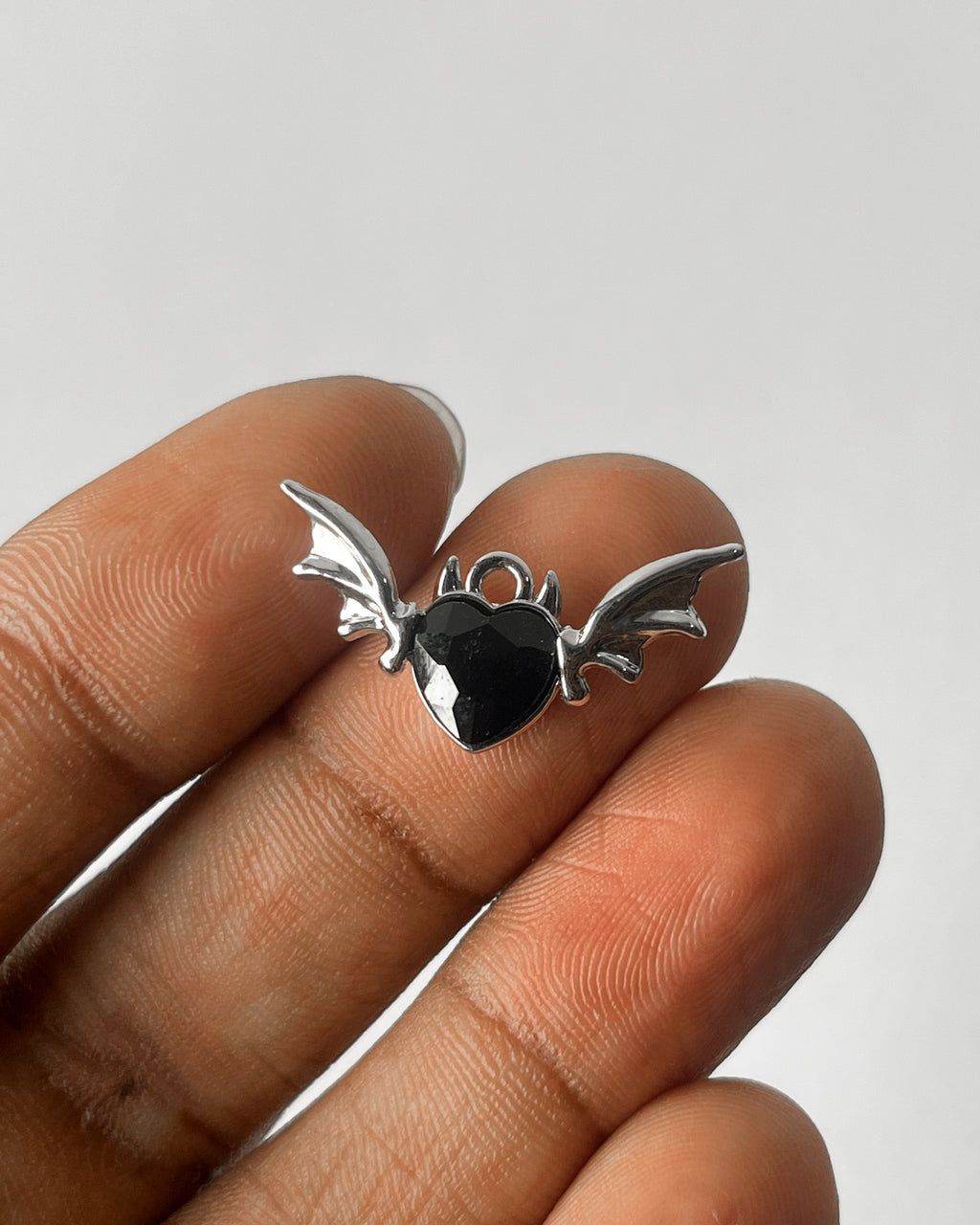 Black heart wing charm