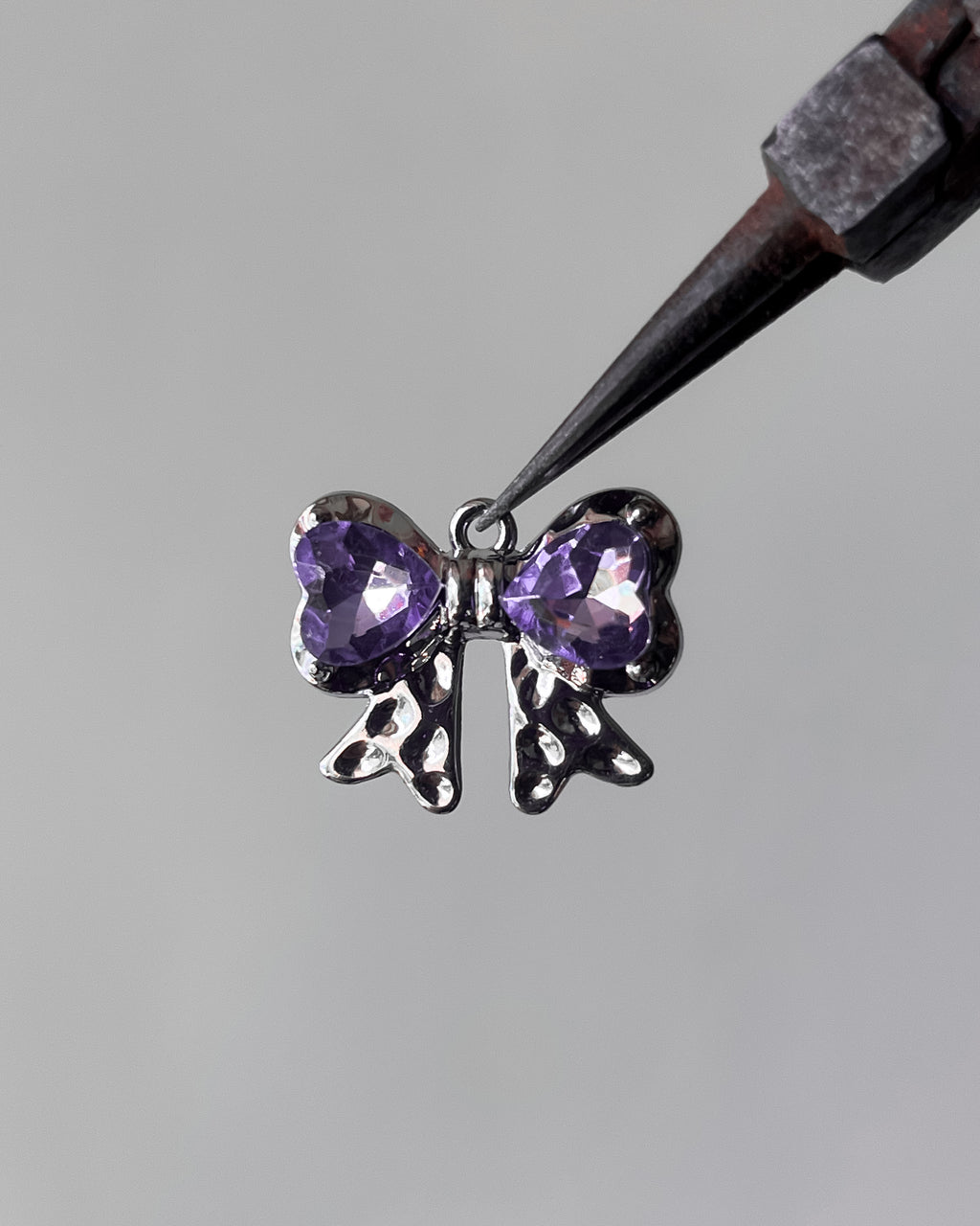 Purple bow charm