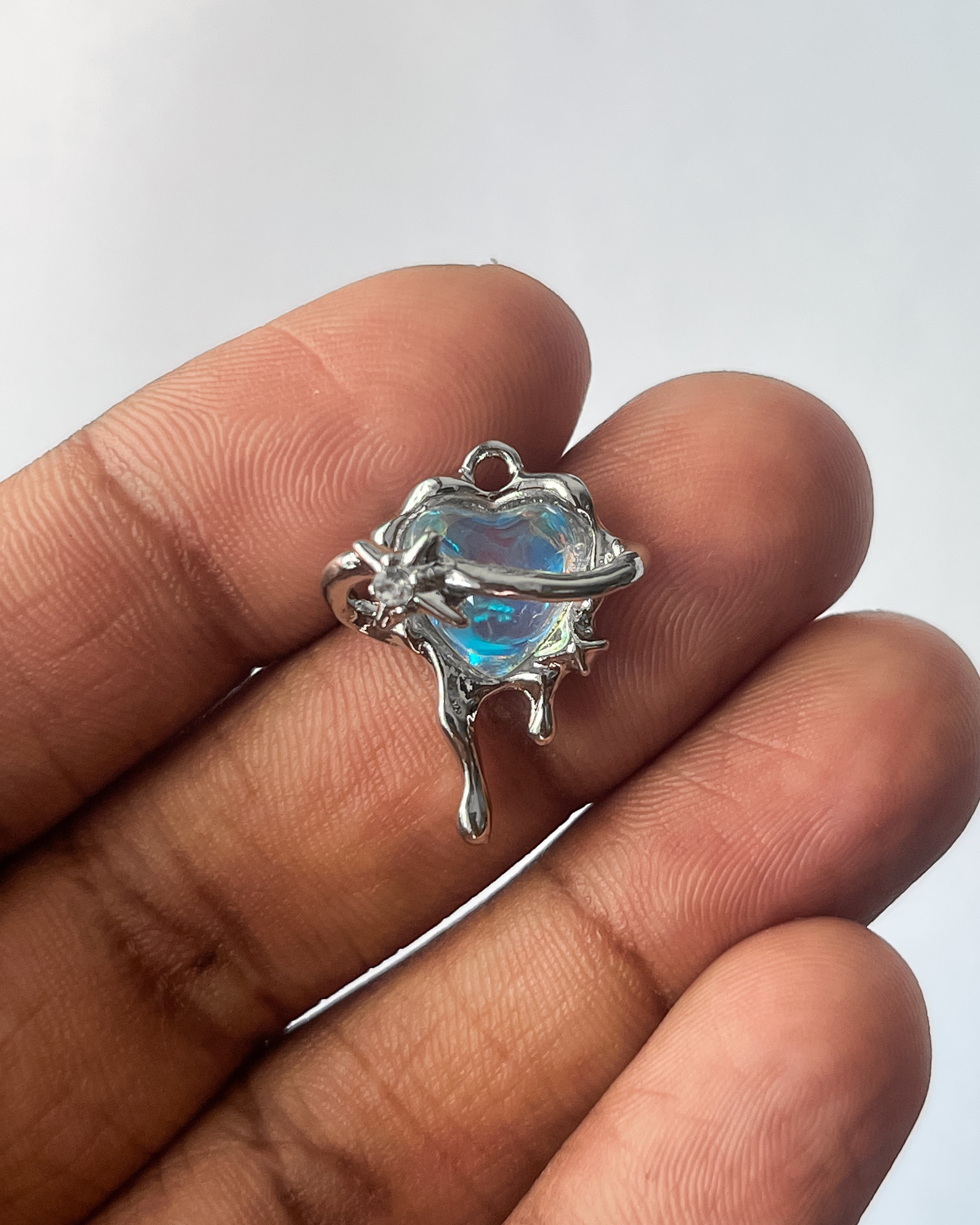 Heart saturn charm