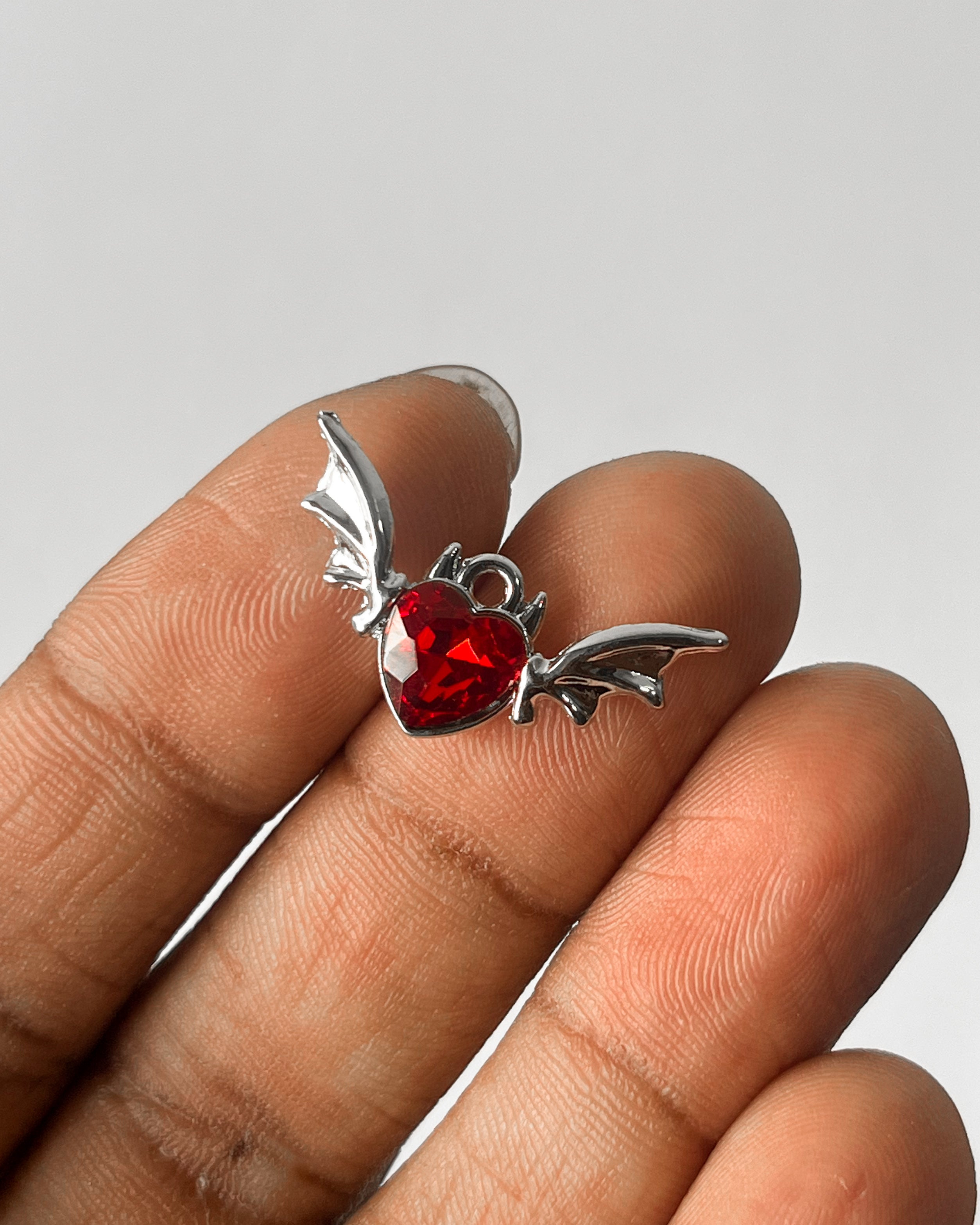 Red heart wing charm