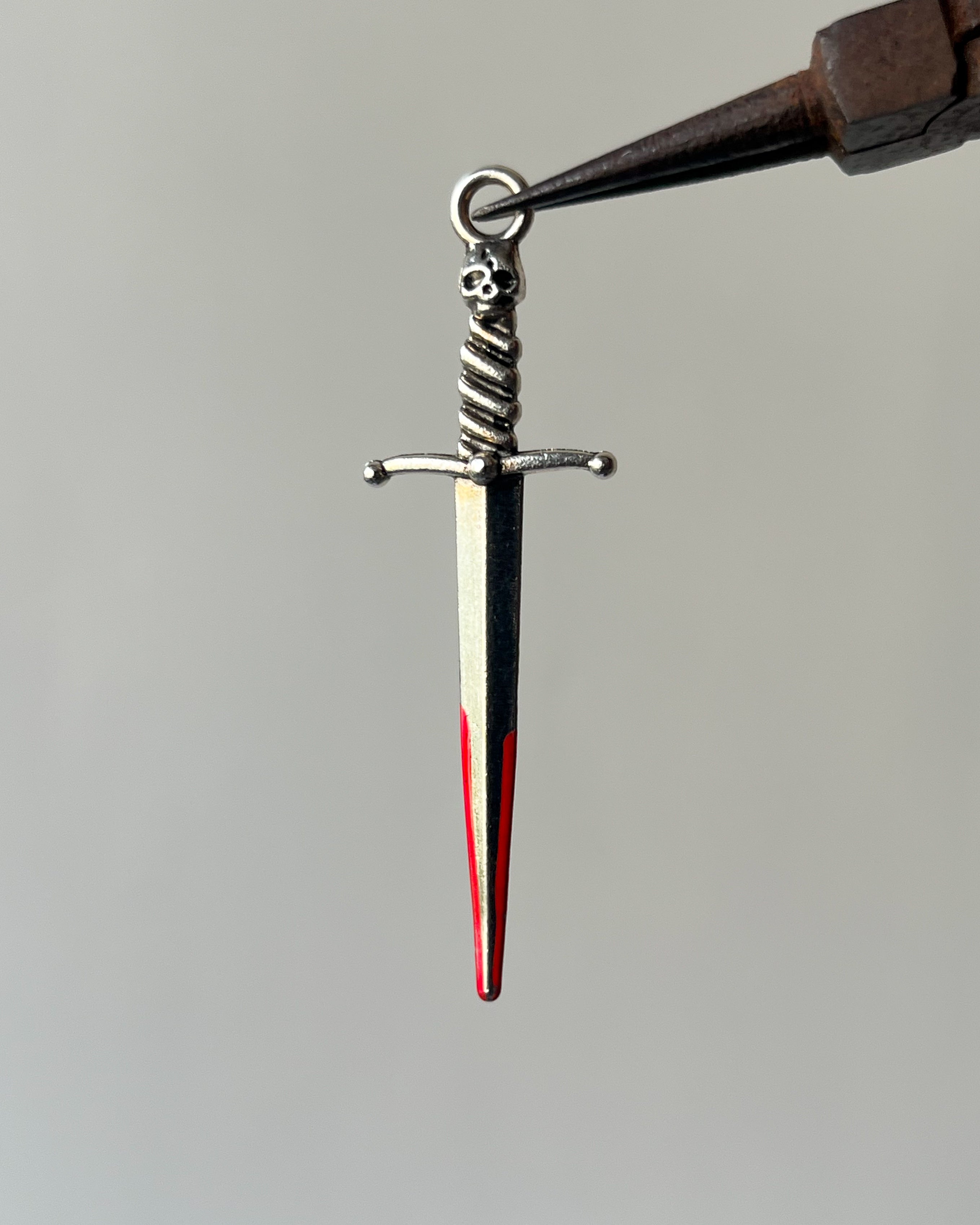 Red sword charm
