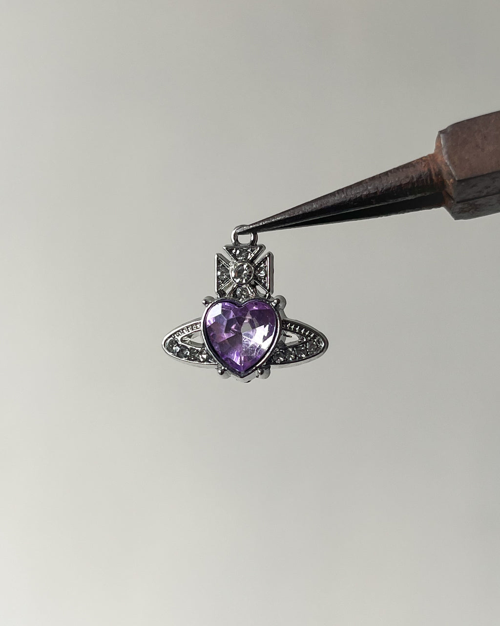 Purple saturn heart charm