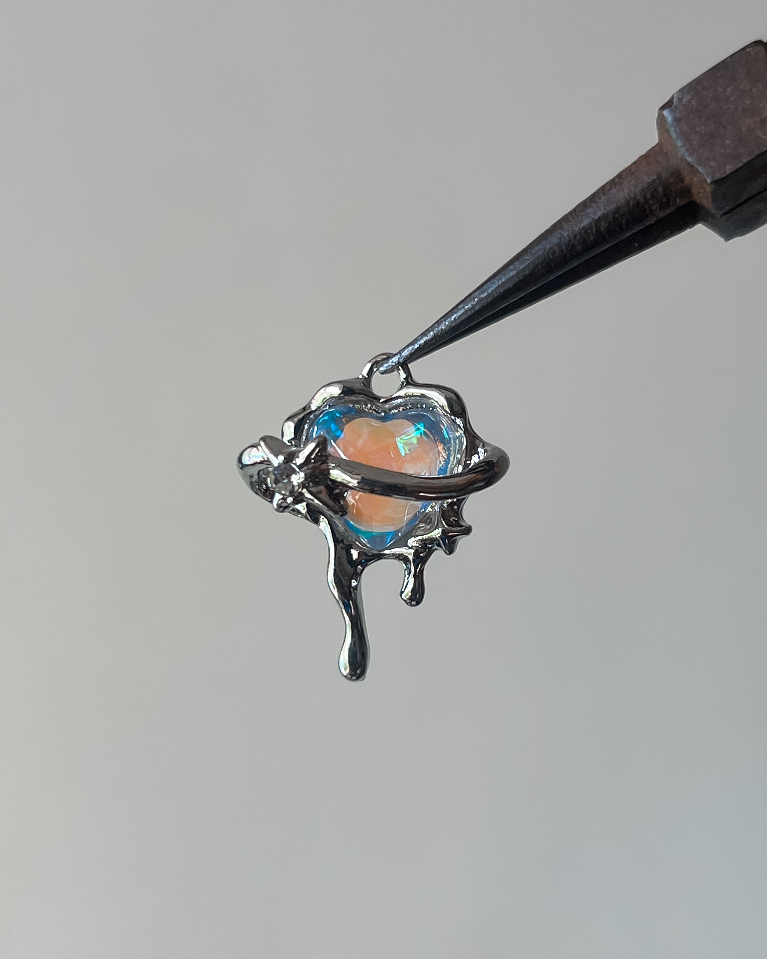 Heart saturn charm
