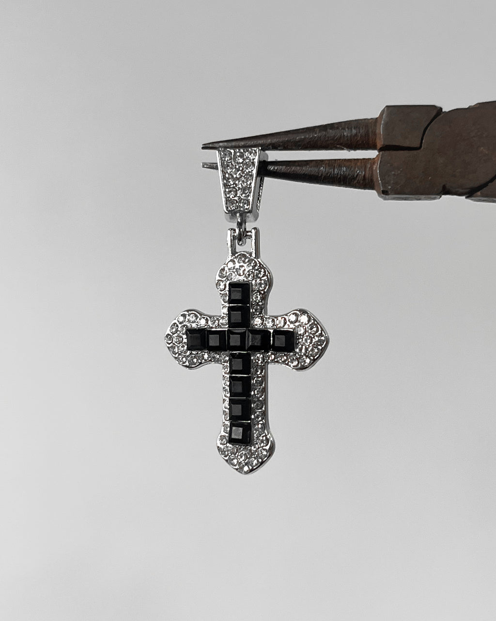 Iced out black cross