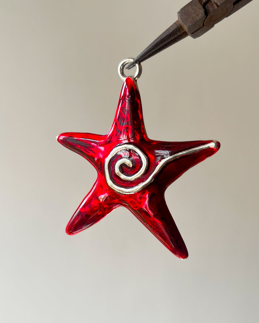 Red Star Swirl charm (designed by sonal bro)