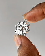 Spider web charm