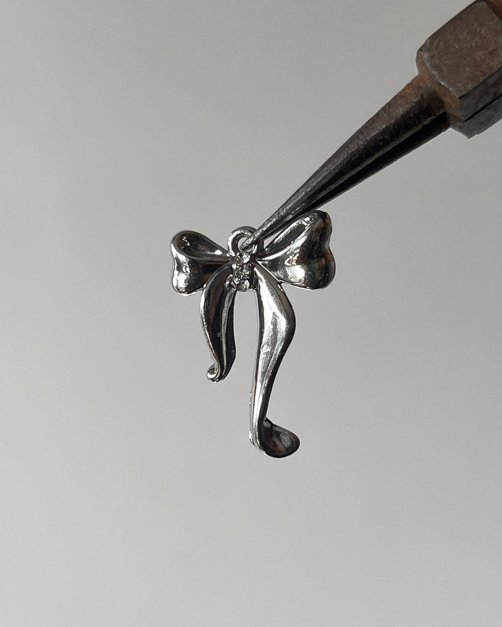 Bow Stone charm