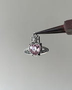 Pink saturn heart charm