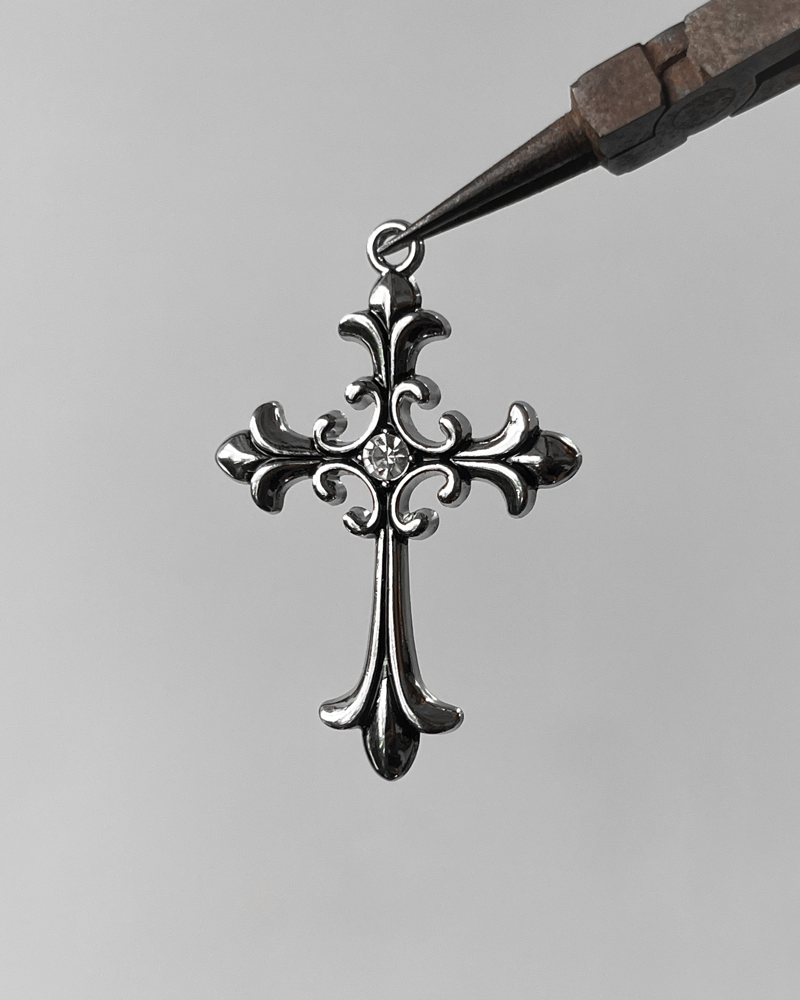 Chrome cross Charm