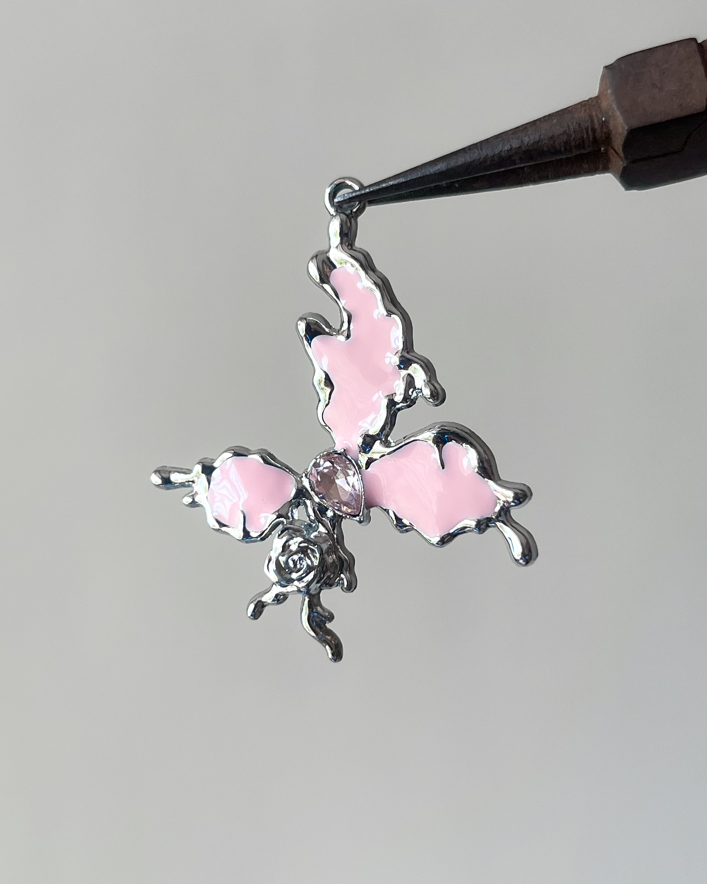 Icy pink butterfly charm