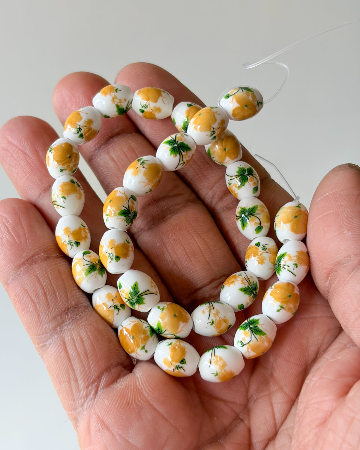2.0 oval ceramic flower beads - 1 line