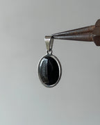 Oval silver charm