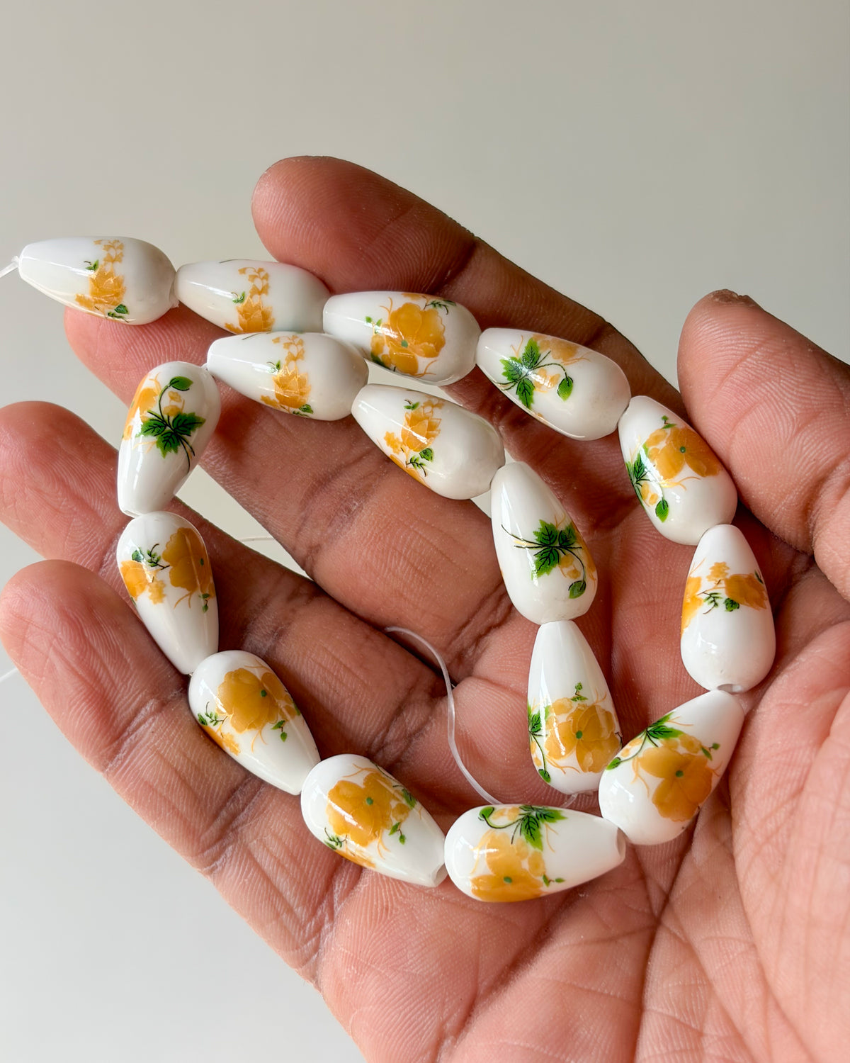 6.0 drop shape ceramic flower beads - 1 line