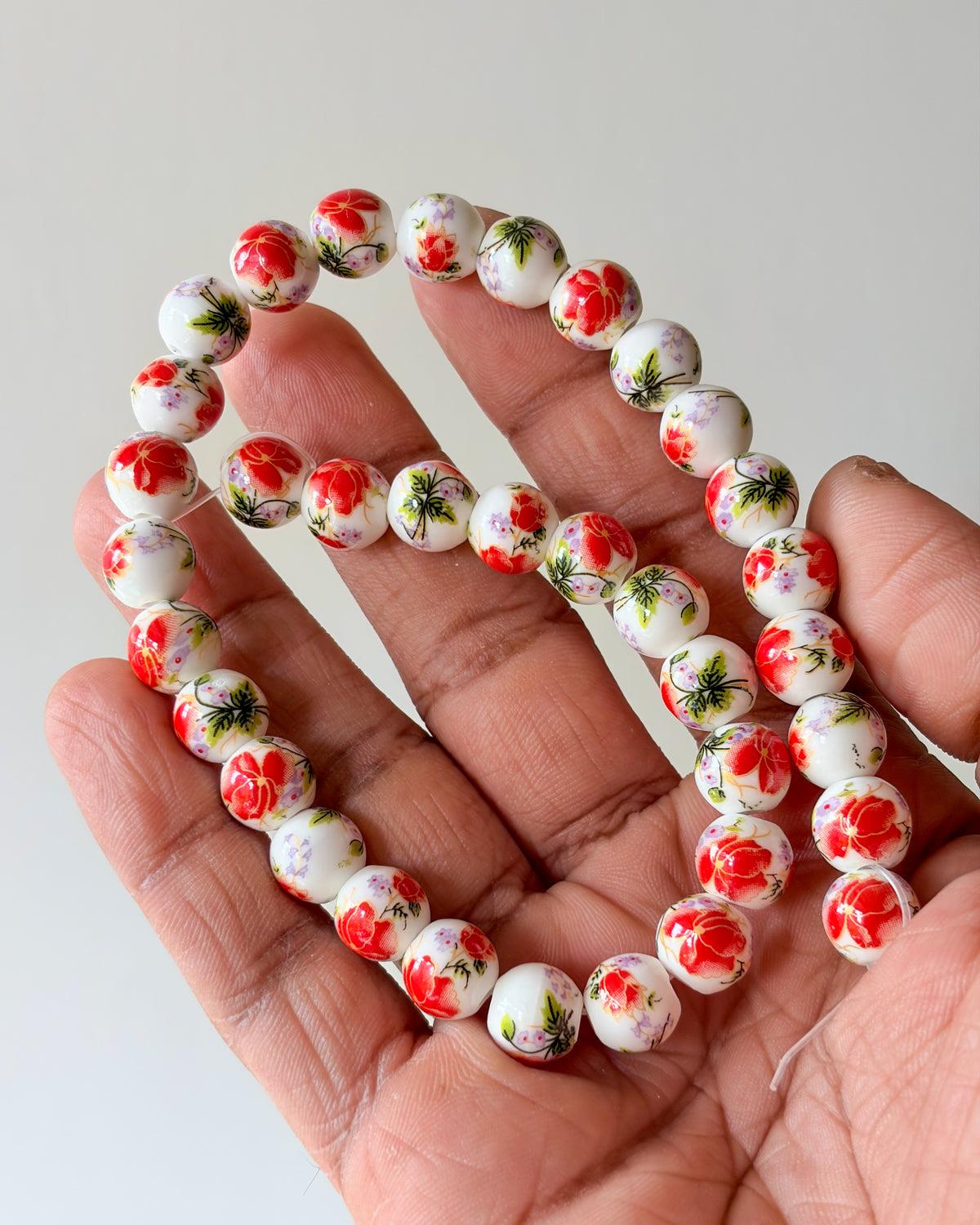 6.0 round ceramic flower beads - 1 line