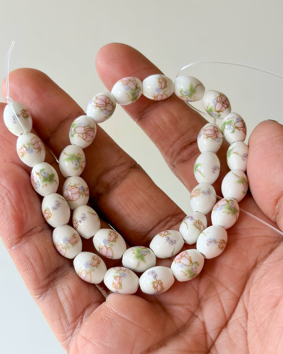 5.0 oval ceramic flower beads - 1 line