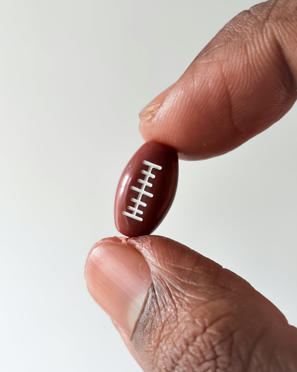Rugby ball beads - 25 grams